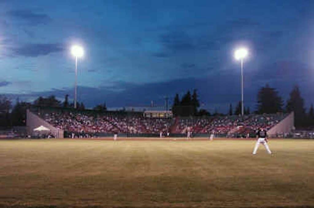Baseball field view with dark sky.