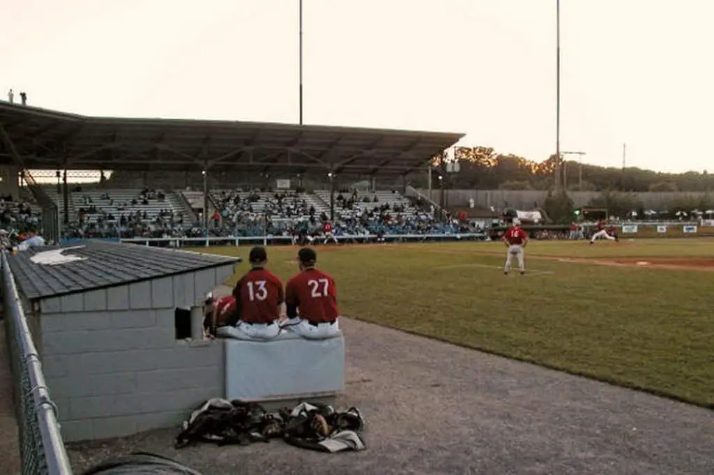 Dugout with waiting players.