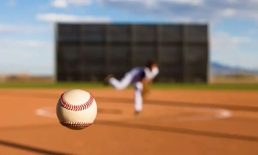 Pitcher throwing a baseball.