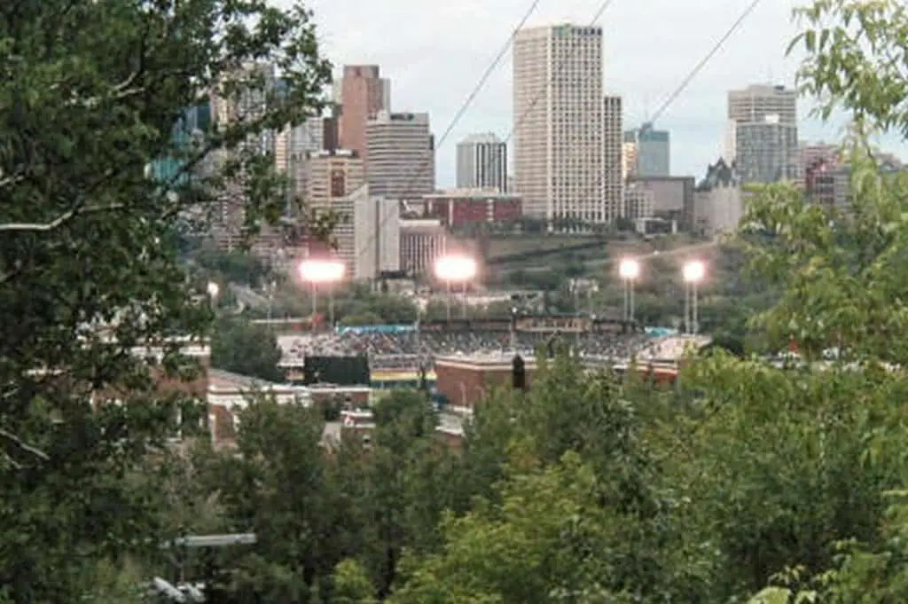 View of Telus Field ballpark from outside with skyscraper in background.