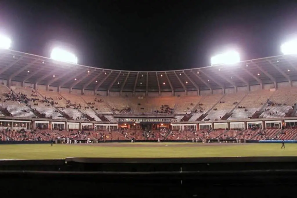 Stadium in the evening with lighting from inside.