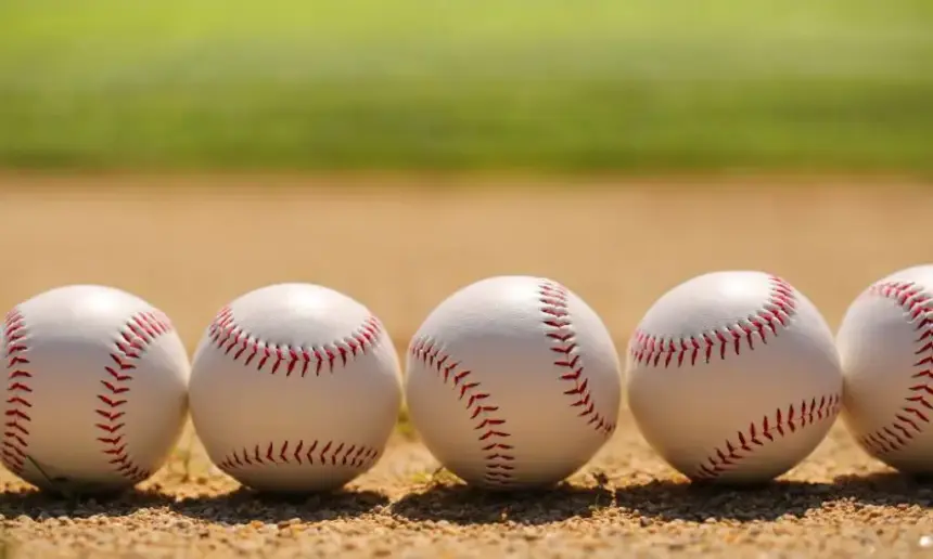 MLB baseball balls on the field.
