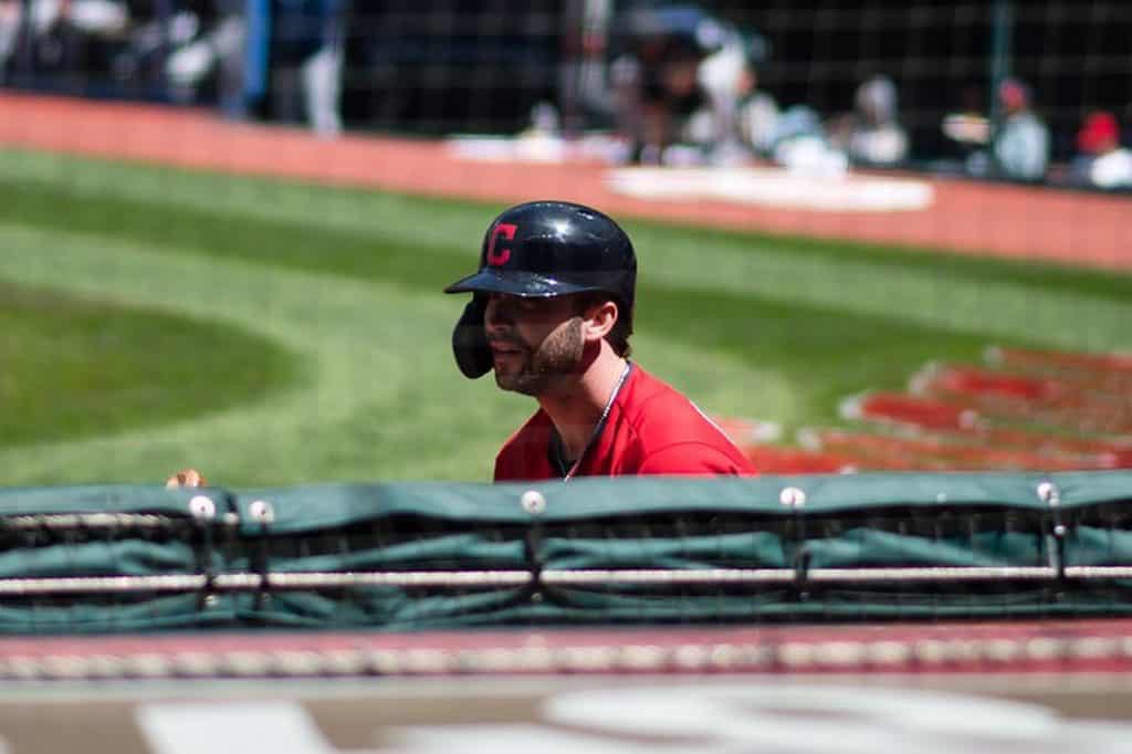 Baseball player with helmet covering only one ear.