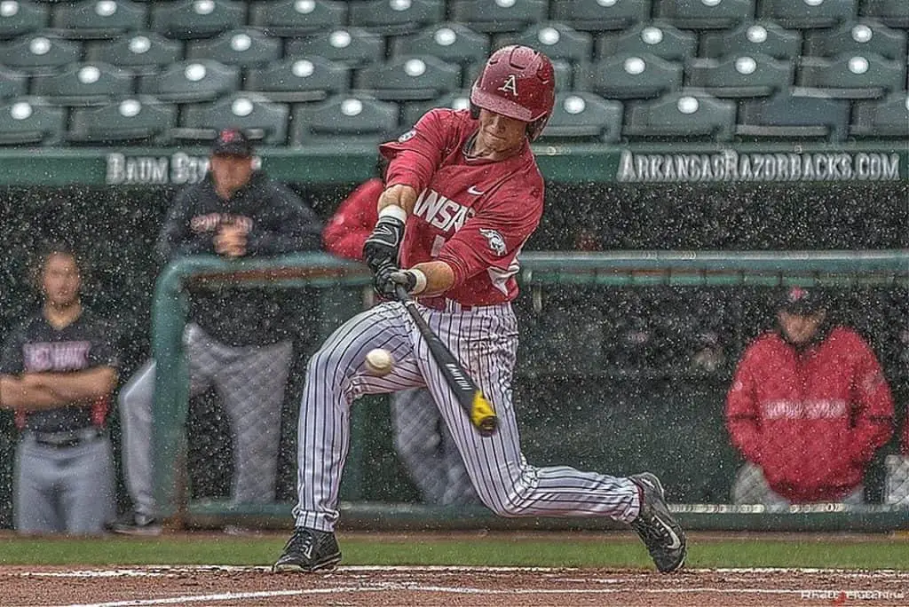 Baseball player batting in the rain