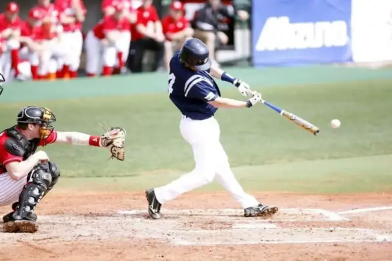 Baseball batter with pine tar on his helmet.