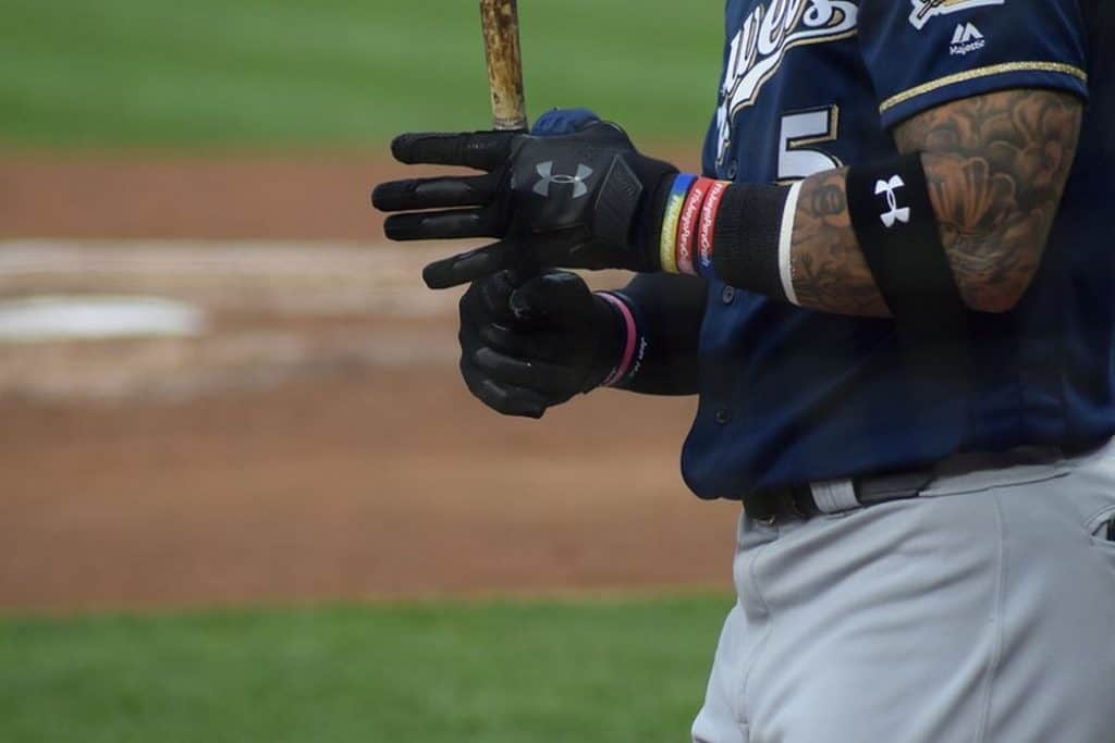 Batter with batting gloves and elbow guard.