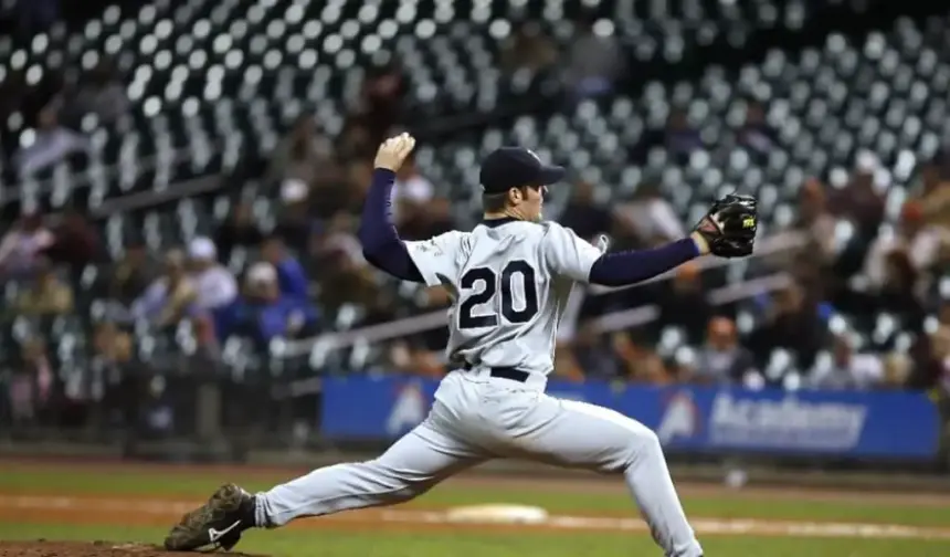 Baseball player pitching a ball.