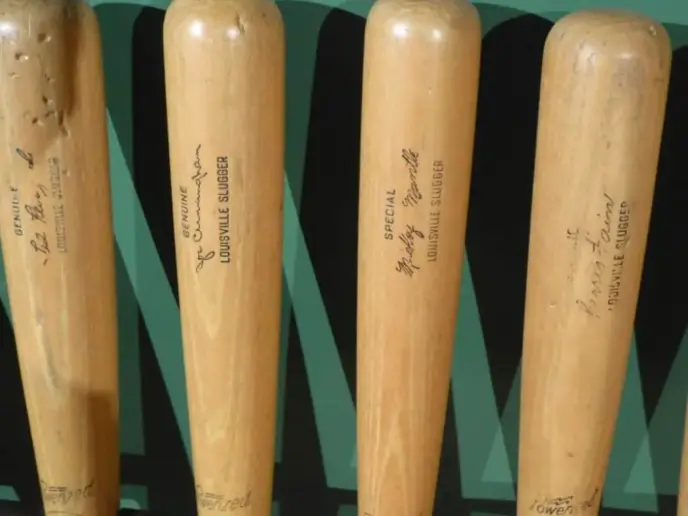 Four louisville wood baseball bats.