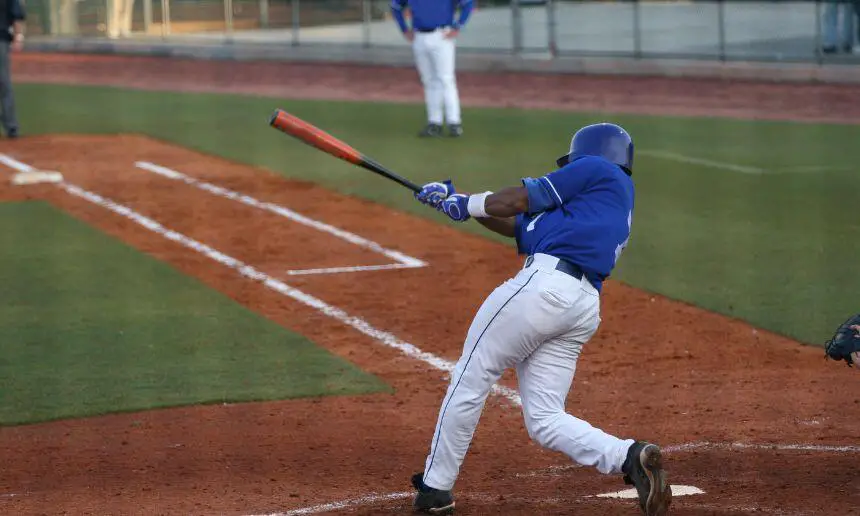 MLB player with a wooden bat.