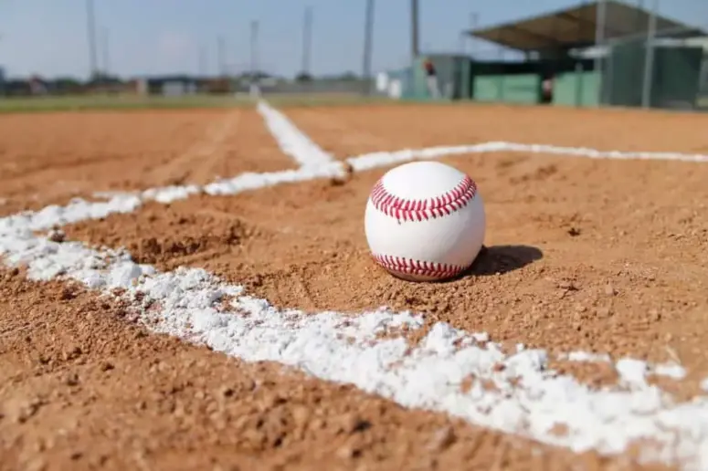 Baseball lying in the dirt.