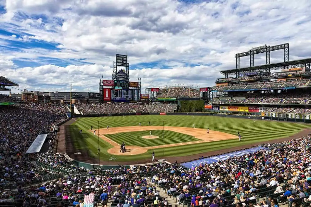 View of a baseball field with a cloudy sky.