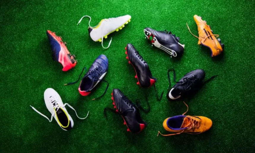 Different types of cleats lie on the green.