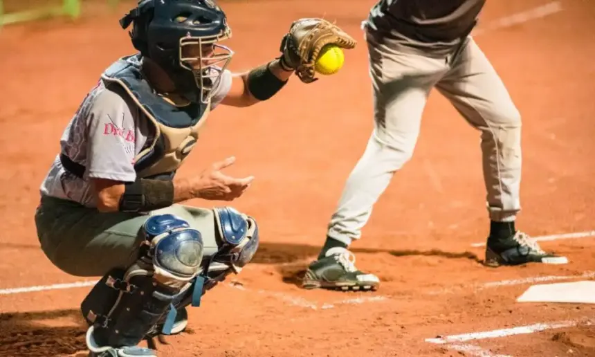 Male softball catcher.