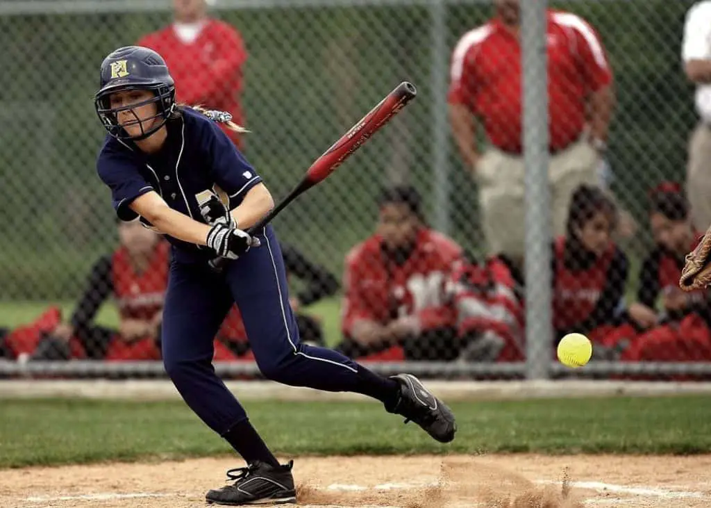 Female softball batter.