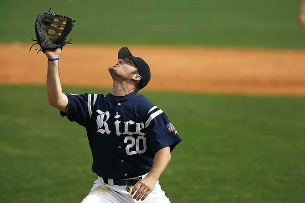 Baseball catcher trying to catch a ball.