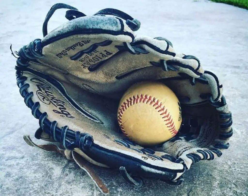 Baseball glove with baseball in it.