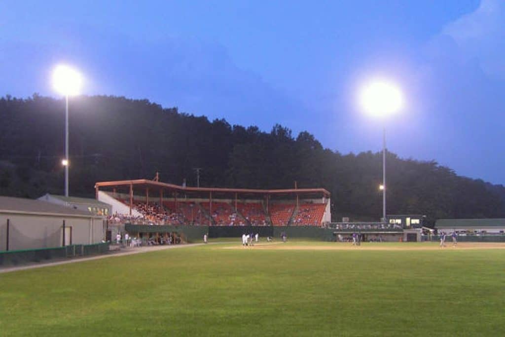 Field in the evening with floodlights on.