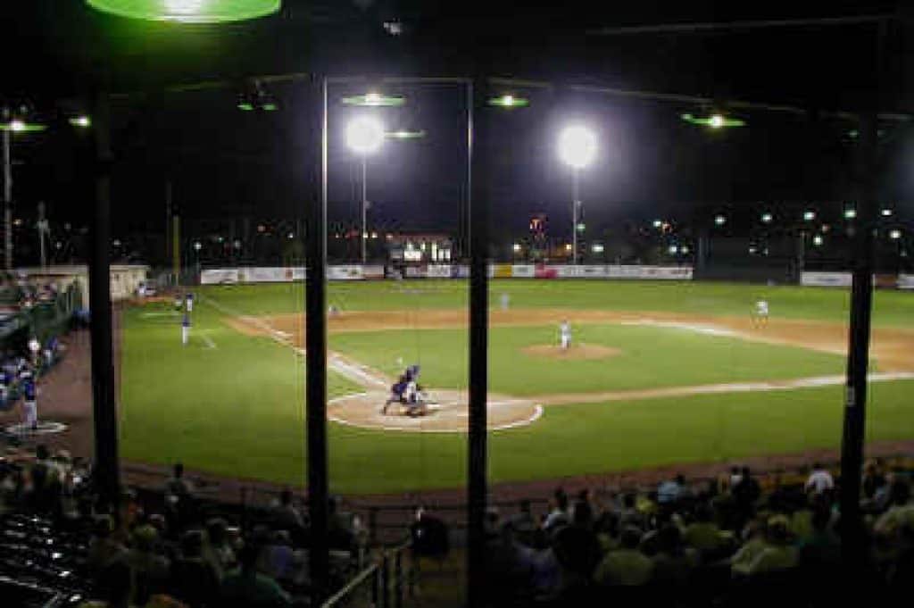 View of the field in the dark with spotlight on.