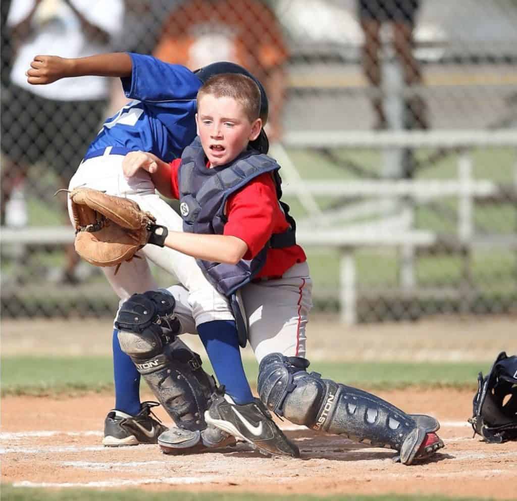 Two children collide at a baseball game.