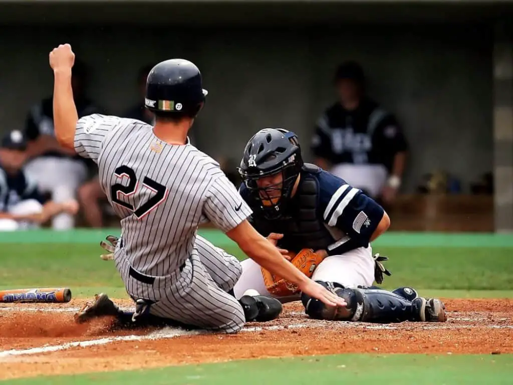 Baserunner sliding into base.