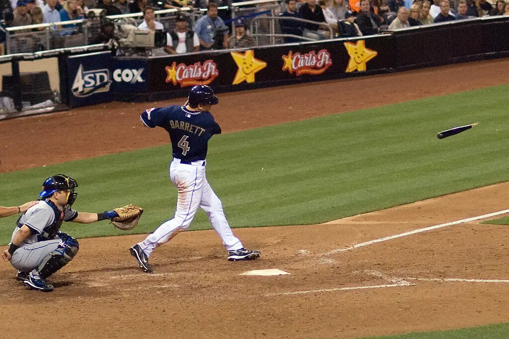 MLB Player breaks his wooden bat during a game.