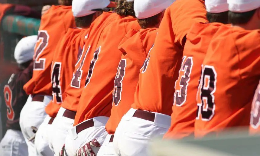 Baseball team in orange uniforms.