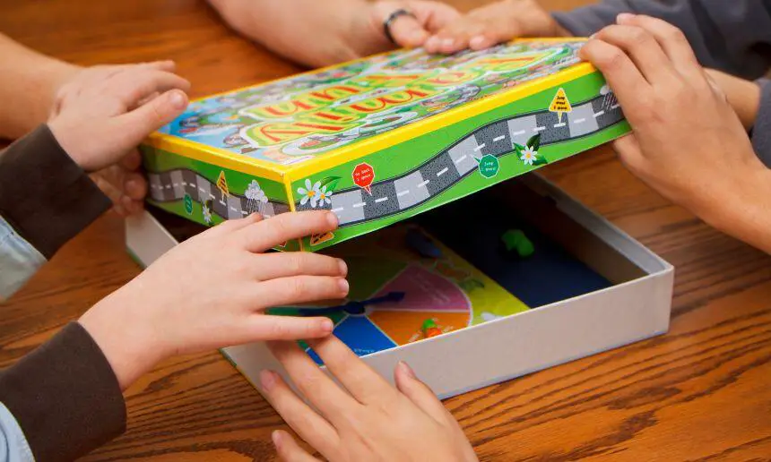 Family choosing a board game to play.